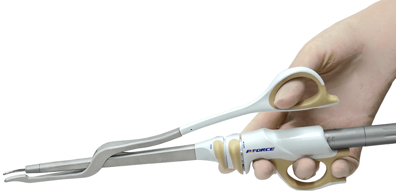 A man holds a scissor type ultrasonic scalpel in his hand